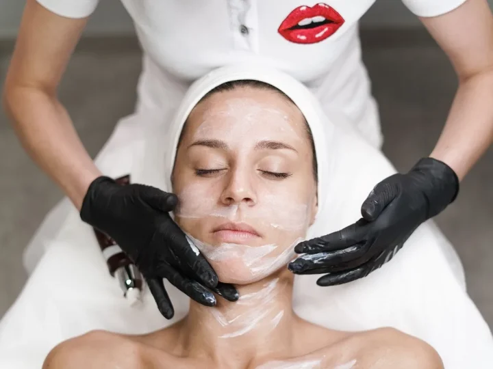 Medical-grade facial treatment with gloved provider